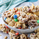 Close up view of a bowl of White Chocolate Party Mix.