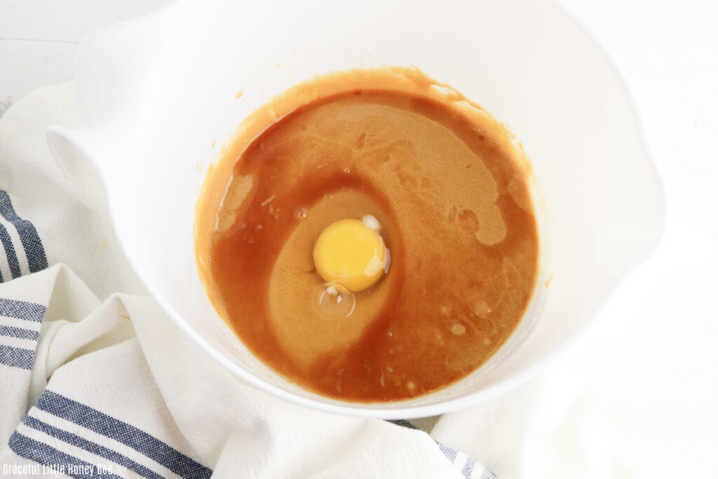 Peanut butter, egg and vanilla in a mixing bowl.