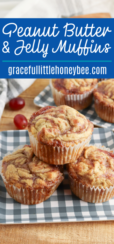 Peanut butter and jelly muffins sitting on a blue and white gingham plate.