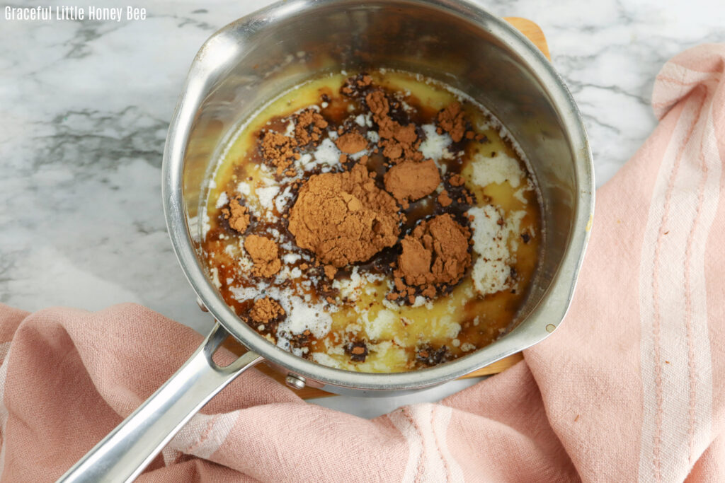 Melted butter, cocoa powder and milk in a saucepan.