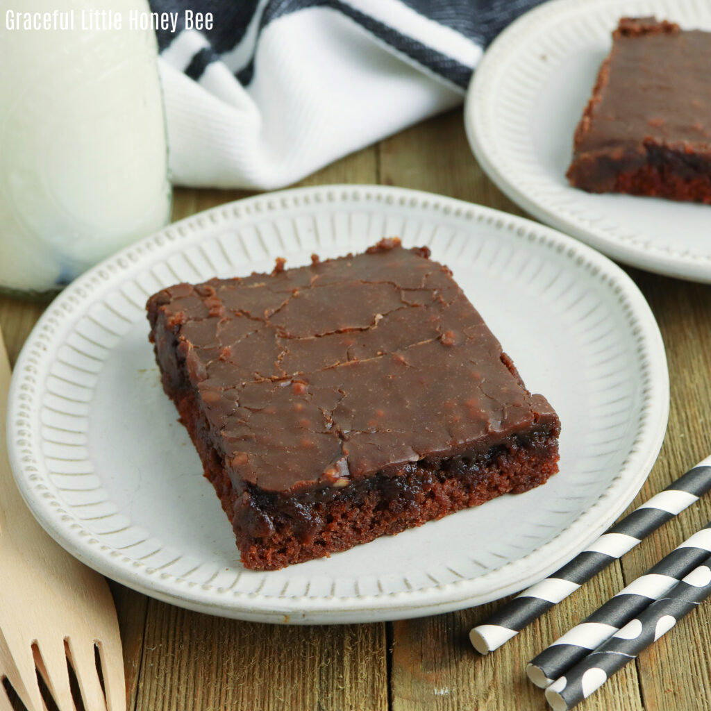 A slice of sheet cake sitting on a plate.