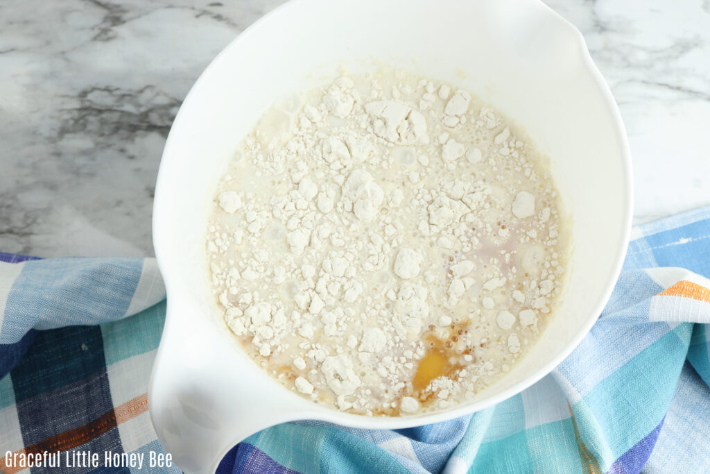 Wet and dry ingredients in a mixing bowl.