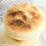 Close up view of a stack of homemade English muffins.