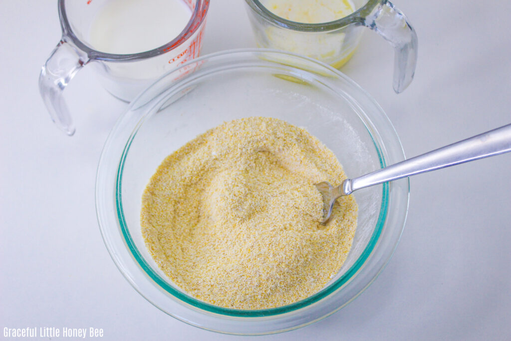 Dry ingredients mixed together in a glass mixing bowl.