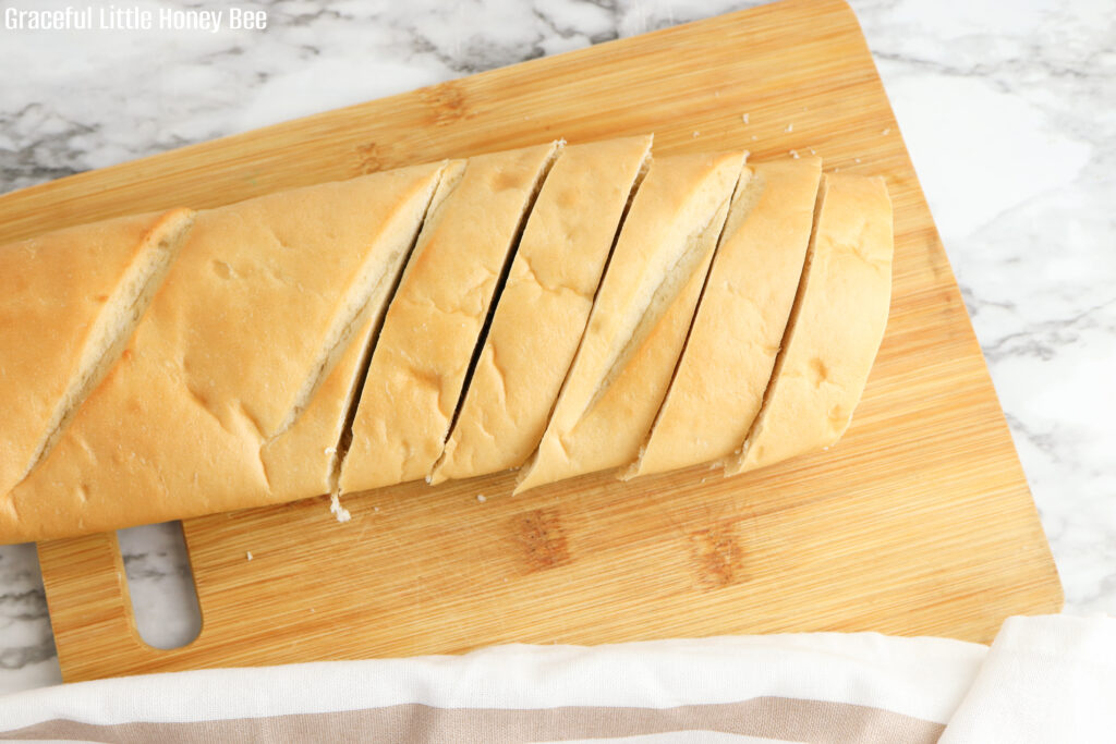 French bread sliced on a cutting board.