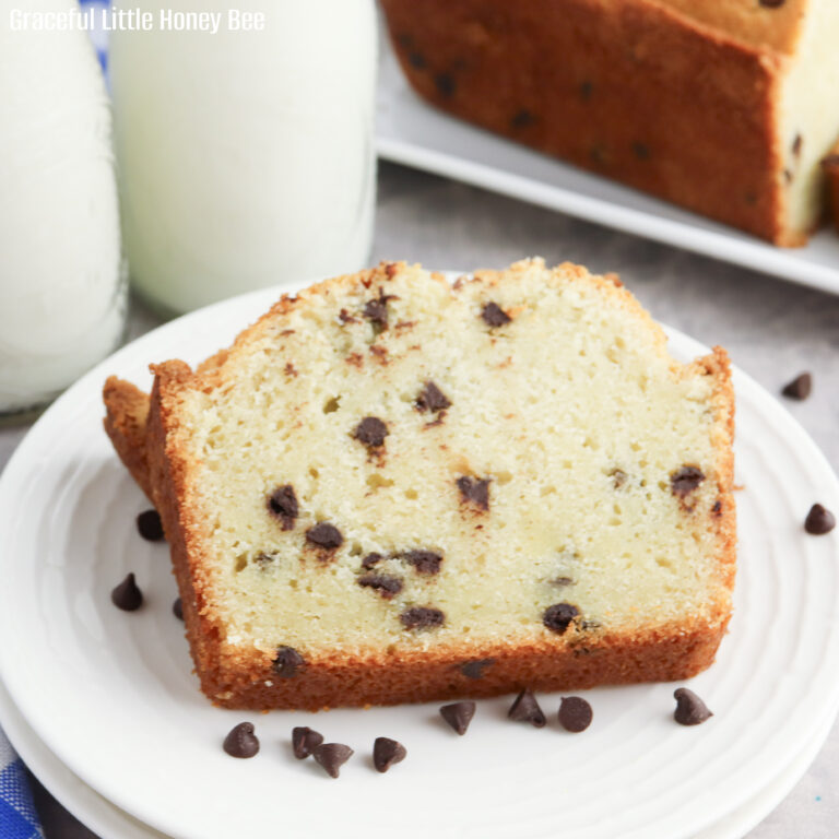 A slice of chocolate chip pound cake on a white plate.