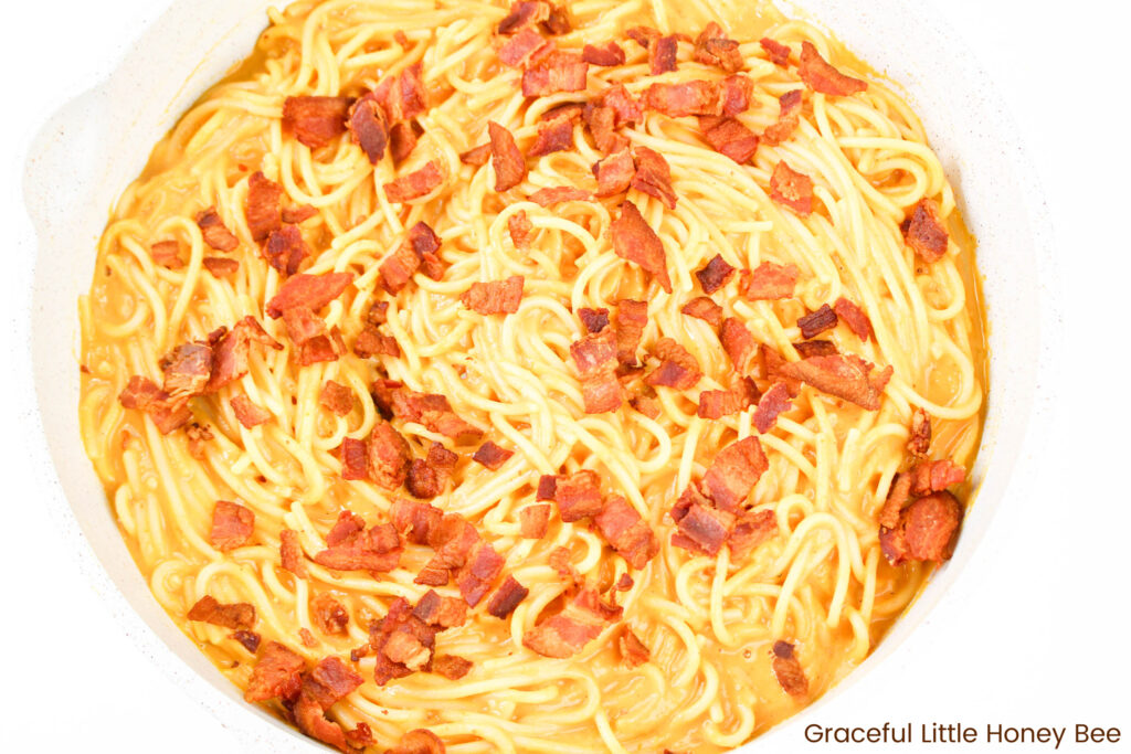 Carbanara topped with crispy bacon.