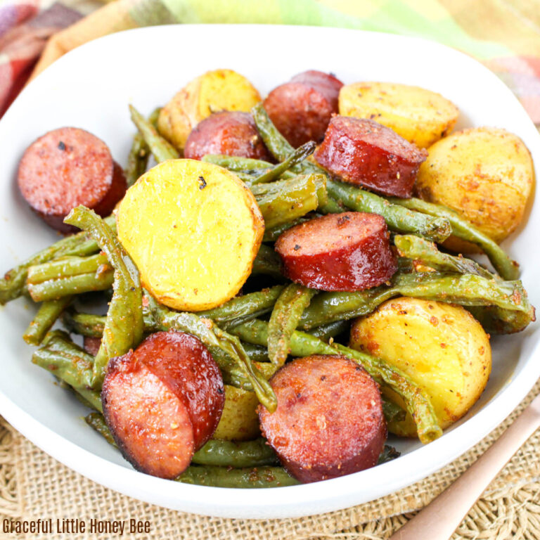 Bowl full of sausage, green beans and potatoes.