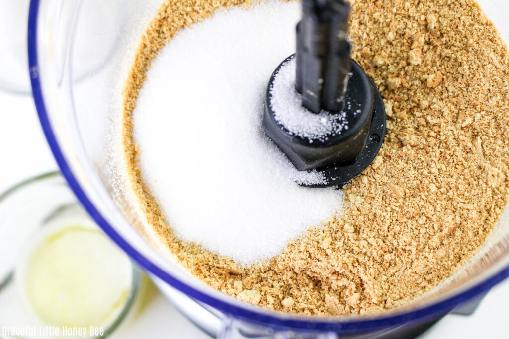 Sugar and crushed graham crackers in a food processor.