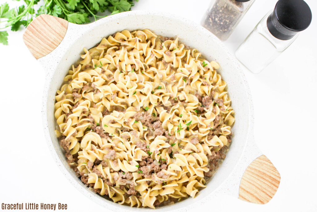 Ground beef and noodles in a pot.