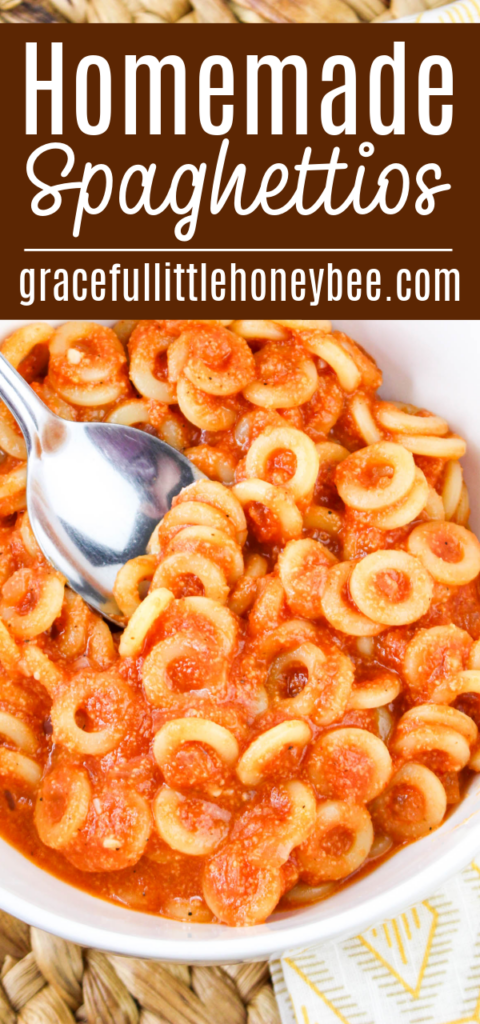 Close up view of Spaghettios in a round white bowl.