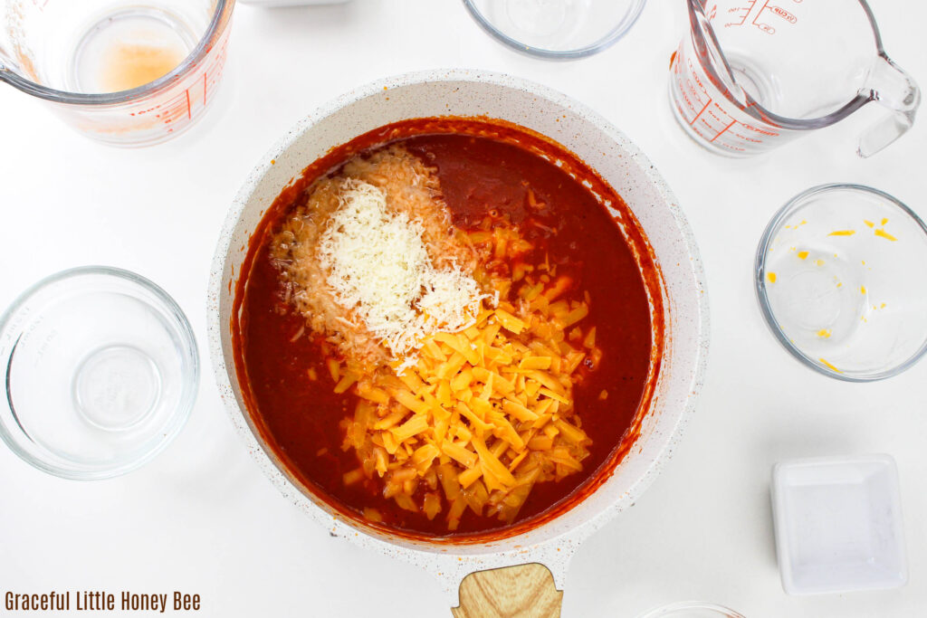 Ingredients for tomato base in a saucepan.