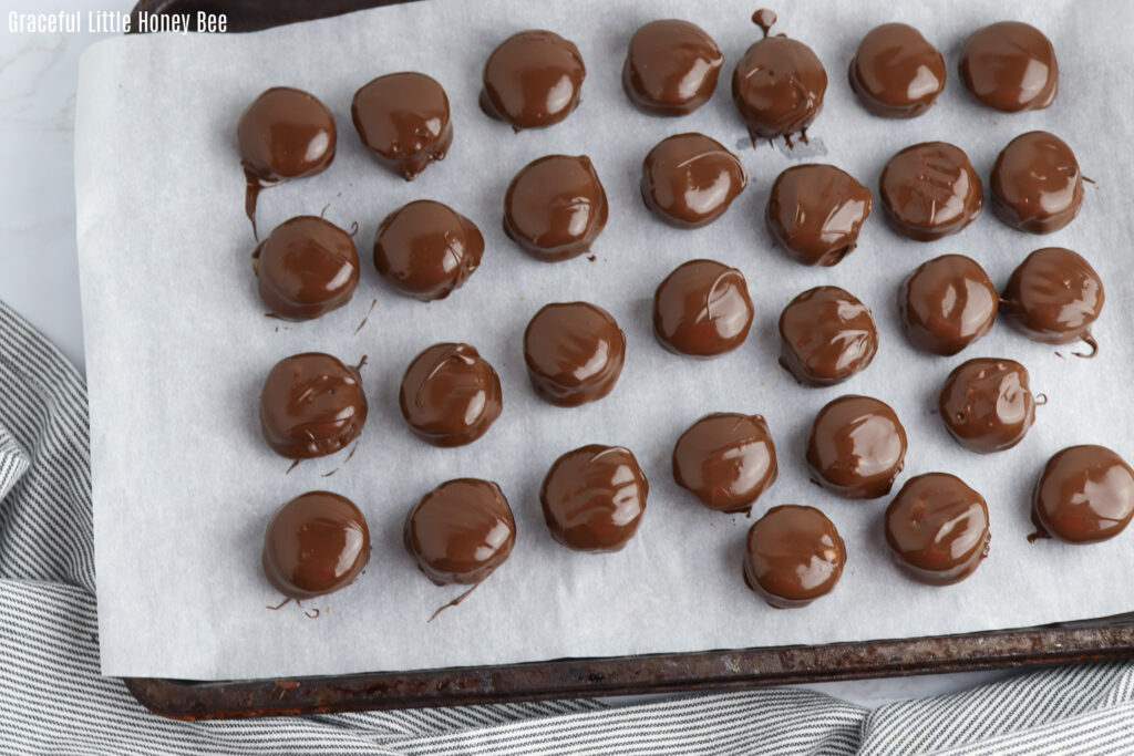 Twix Cookies sitting on a baking sheet.