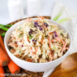 A white bowlful of Cajun Coleslaw.