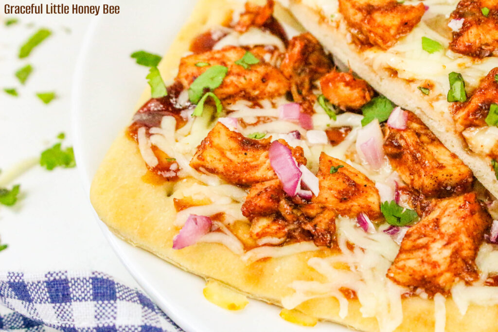 Slices of BBQ Chicken Flatbread pizza on a plate.