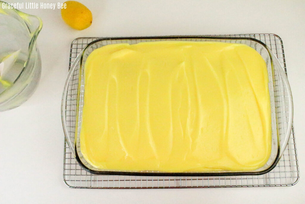 Aerial view of lemon cake topped with pudding.