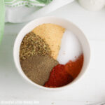 All seasonings in a bowl before being mixed together.