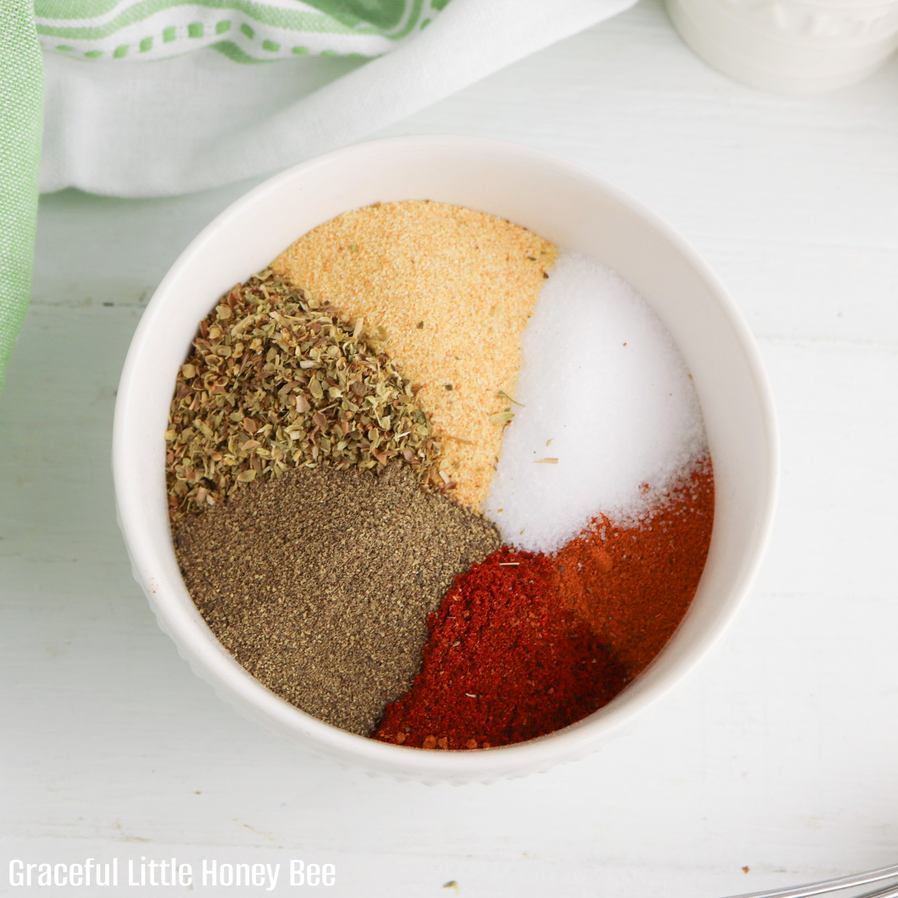 All seasonings in a bowl before being mixed together.