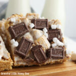 Close up view of s'mores bars on a white plate.