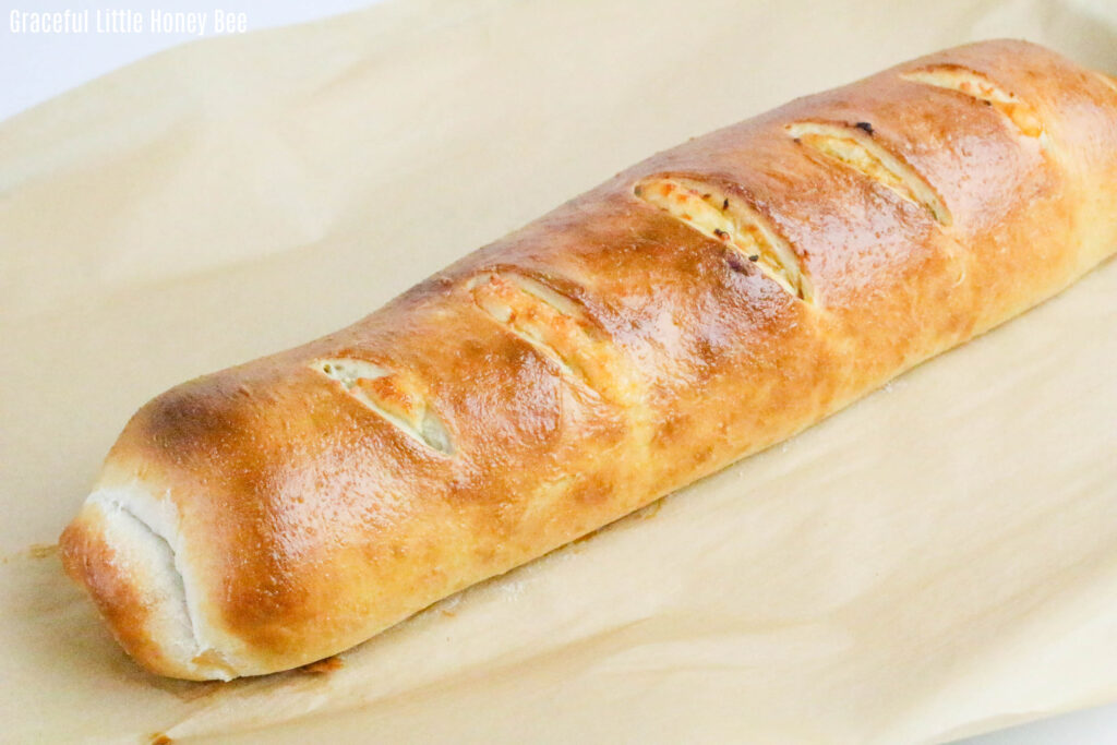 Top view of golden brown Stromboli before being sliced.