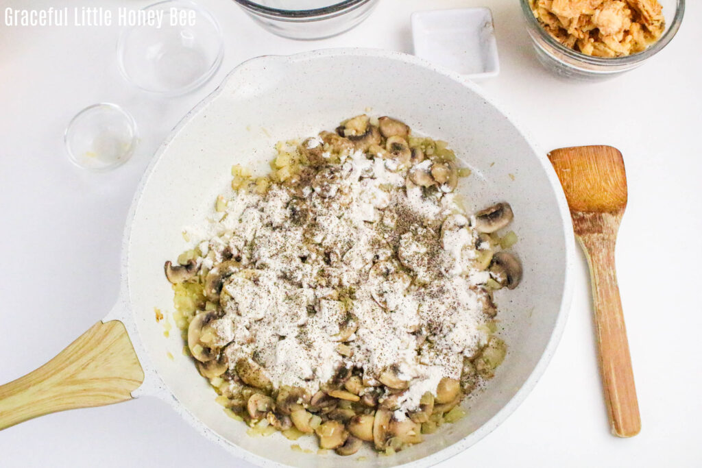 Sauteed mushrooms topped with flour.