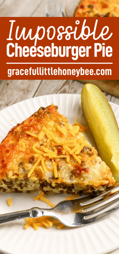 A slice of Cheeseburger Pie on a white plate with a pickle and fork.