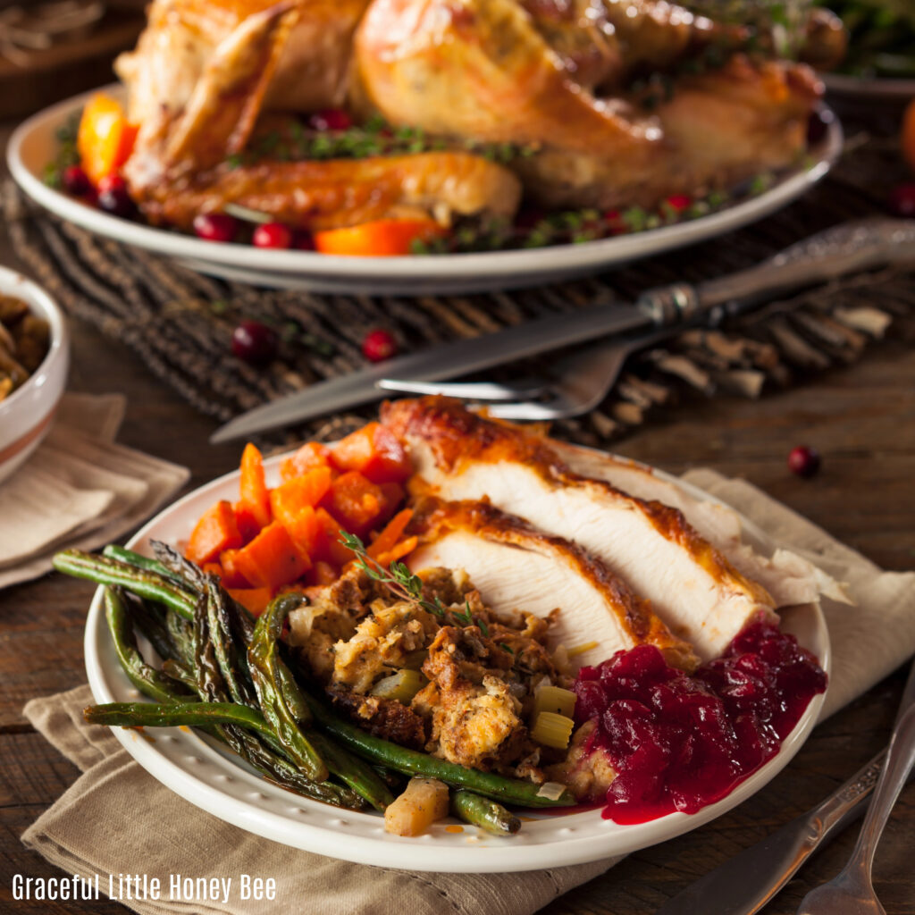 A plate filled with traditional Thanksgiving foods.