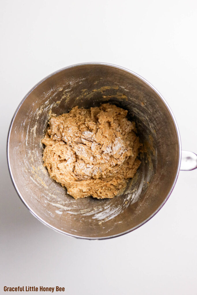 Cinnamon roll dough in a mixing bowl.