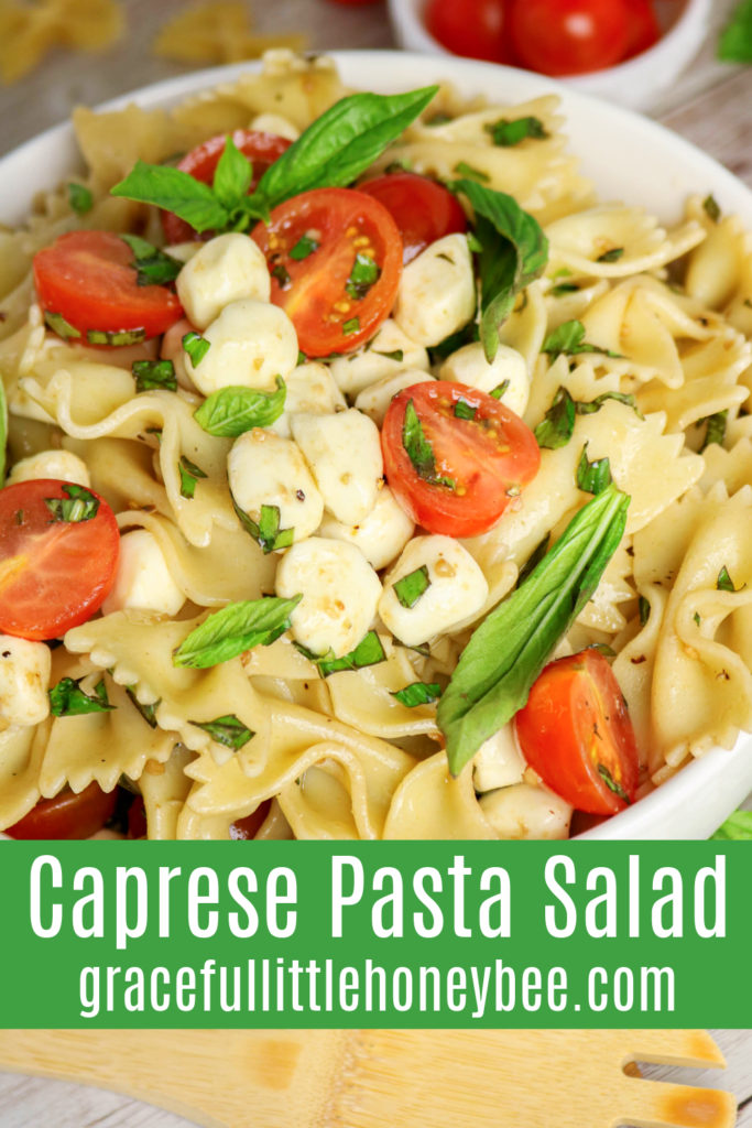 Close up view of Caprese Pasta Salad garnished with basil.